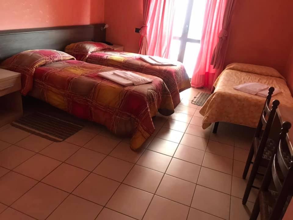 Postel nebo postele na pokoji v ubytování Hotel ristorante 2 Platani