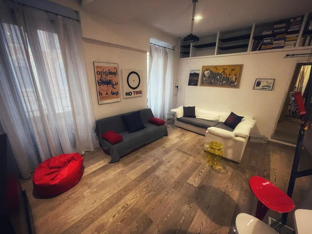 a living room with two couches and a couch at Testaccio Stay - your home in the heart of Rome in Rome