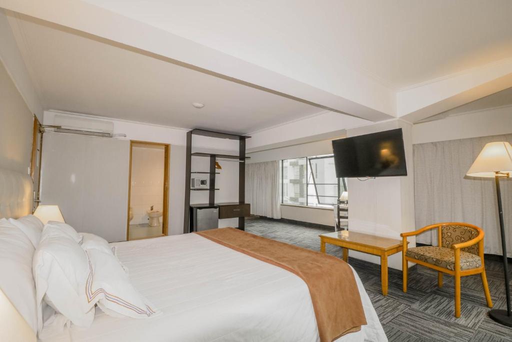 Postel nebo postele na pokoji v ubytování Hotel Miramar