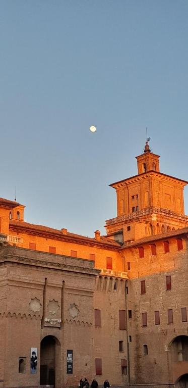 a building with a tower on top of it at Al Castello in Ferrara