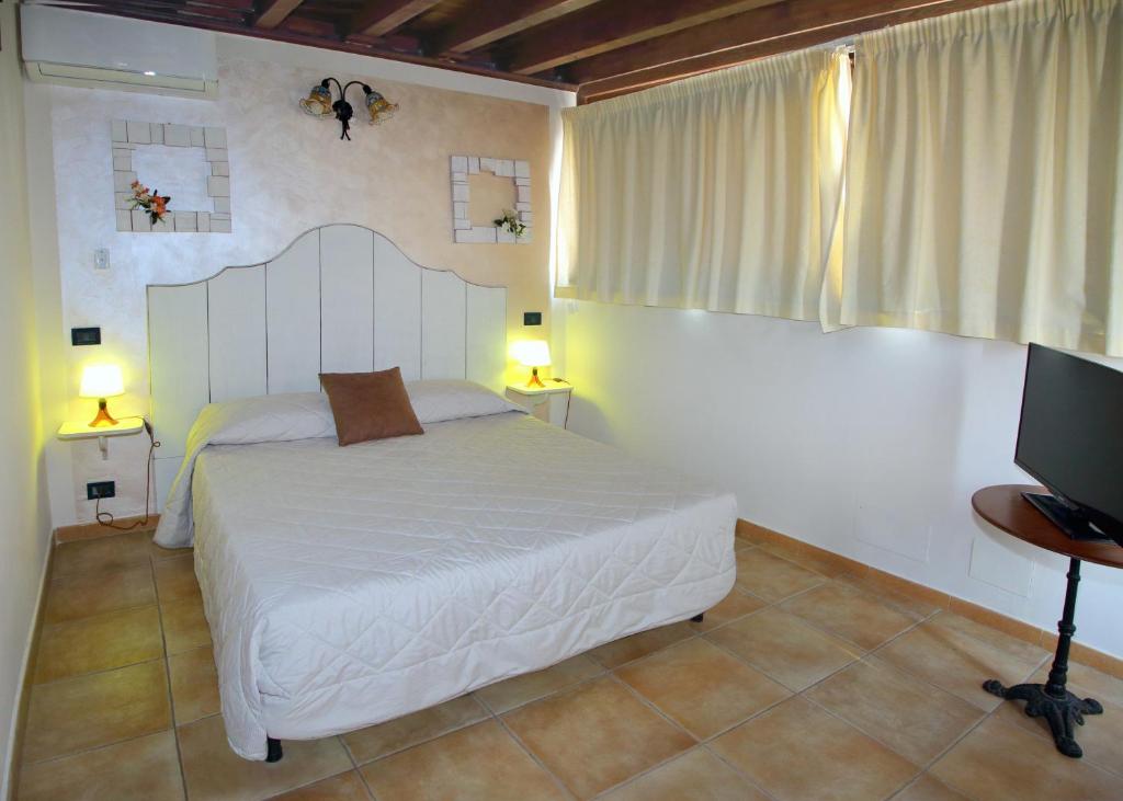 Postel nebo postele na pokoji v ubytování Bed and Breakfast Conte Luna