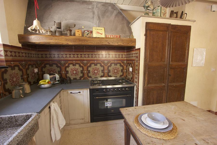 Kuchyň nebo kuchyňský kout v ubytování Casa Aquarela