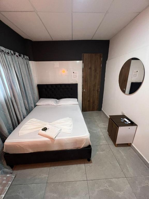 Postel nebo postele na pokoji v ubytování Hotel Almalu
