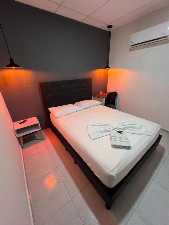 Postel nebo postele na pokoji v ubytování Hotel Almalu