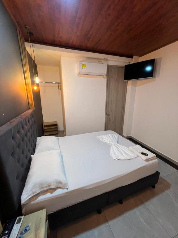 Postel nebo postele na pokoji v ubytování Hotel Almalu