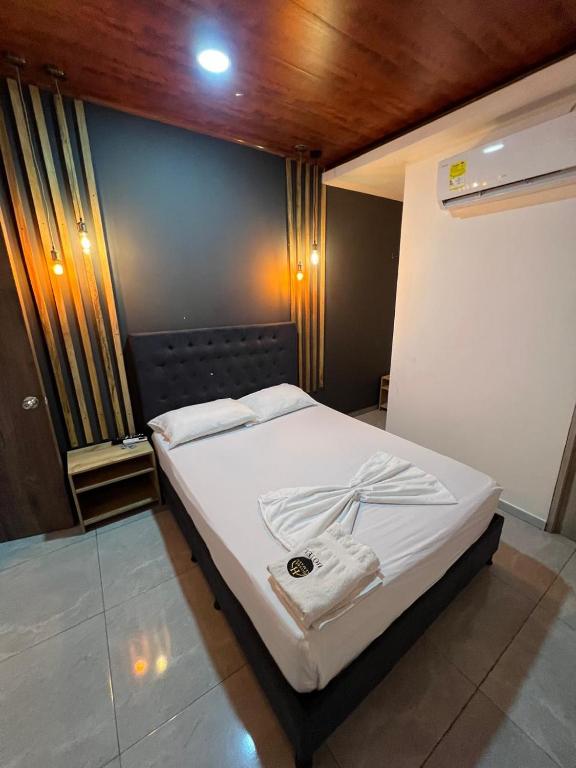 Postel nebo postele na pokoji v ubytování Hotel Almalu
