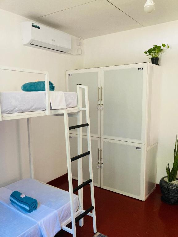 Postel nebo postele na pokoji v ubytování Memo's Inn
