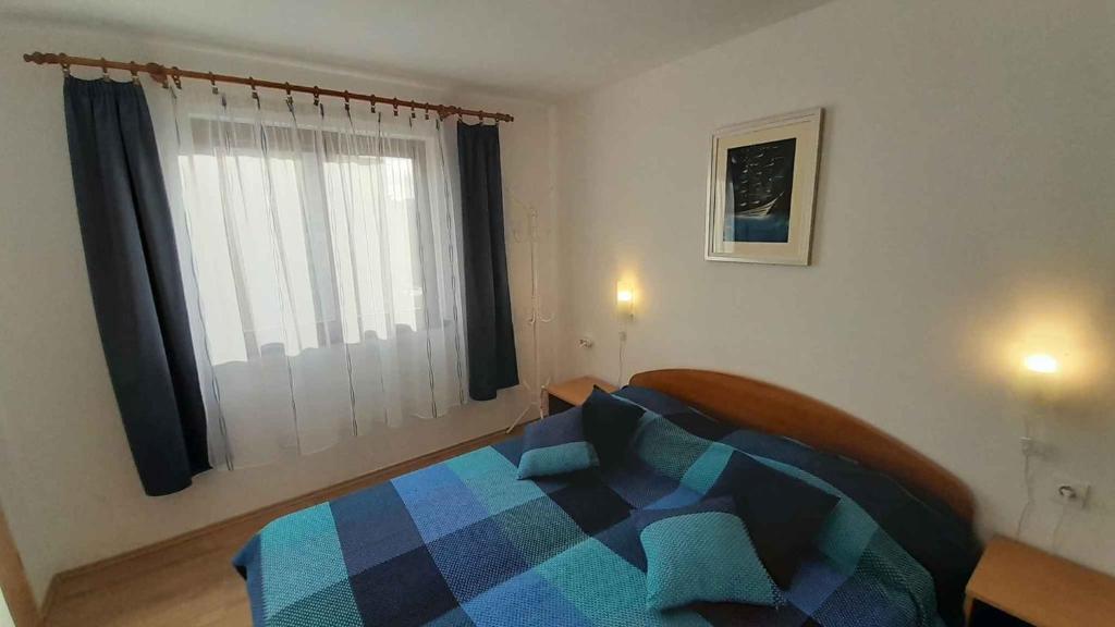 Postel nebo postele na pokoji v ubytování Apartment Porat 22