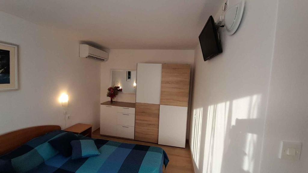 Postel nebo postele na pokoji v ubytování Apartment Porat 22
