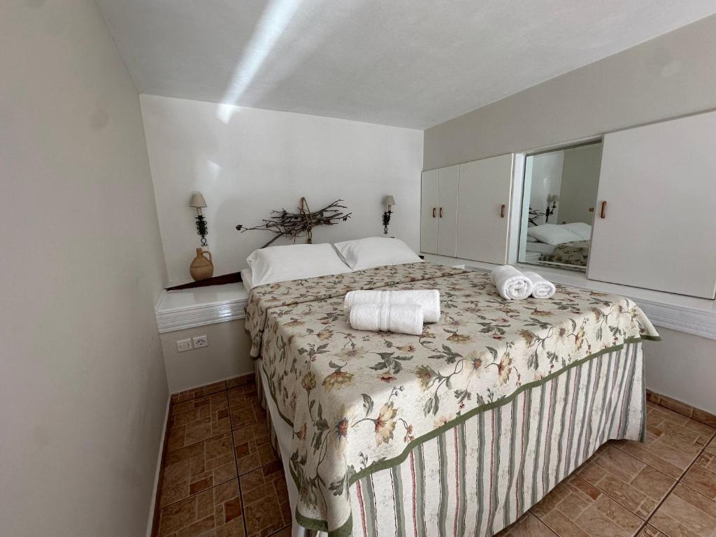 Postel nebo postele na pokoji v ubytování Caldera Apartments Assos