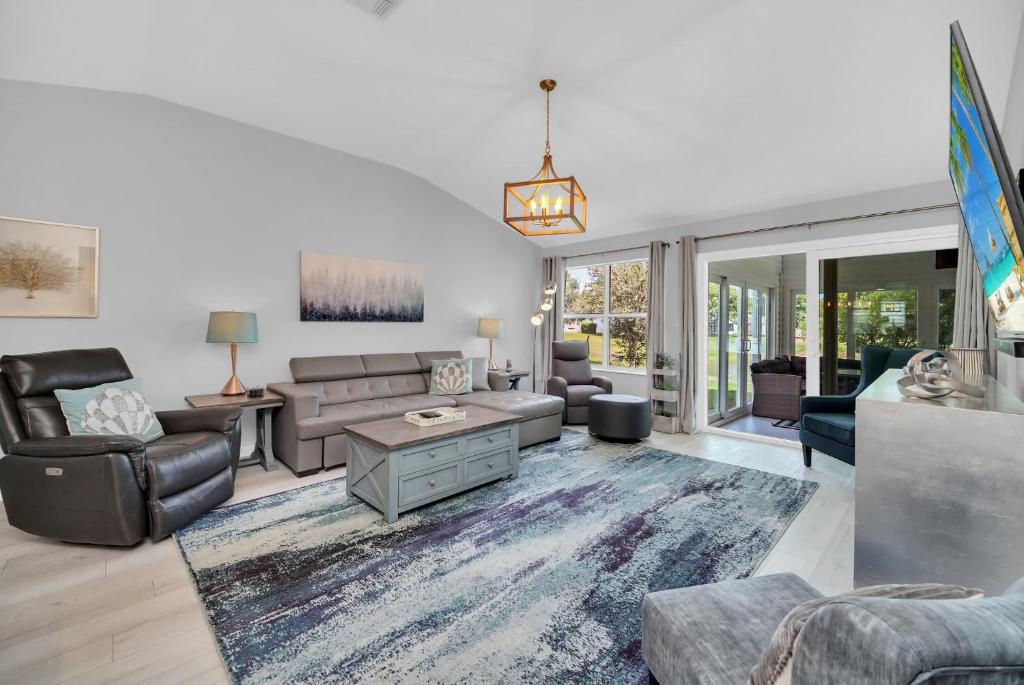 a living room with a couch and a table at Waterfront 3Bed in The Villages in The Villages