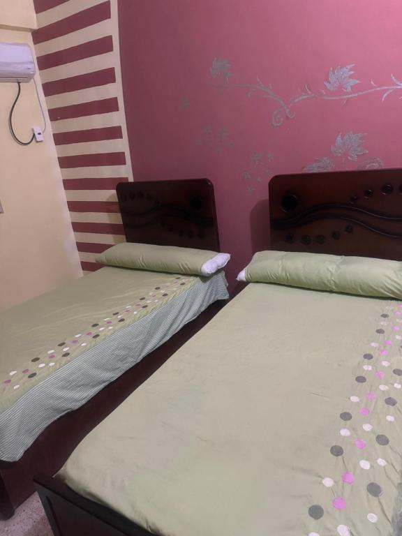 Postel nebo postele na pokoji v ubytování SEO House