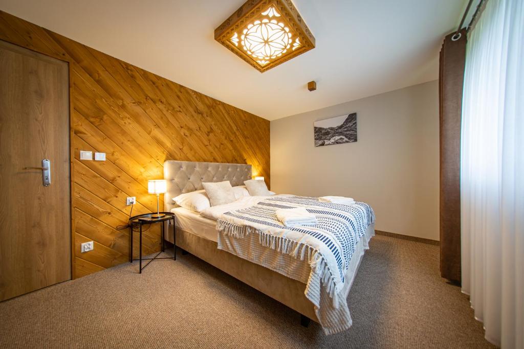 Postel nebo postele na pokoji v ubytování River ApartHouse Zakopane