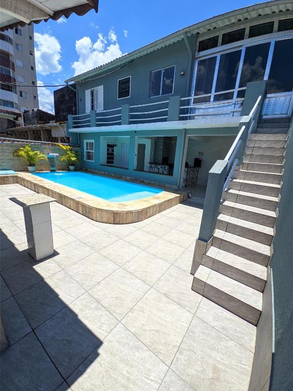 Imagine din galeria proprietății Edícula completa com piscina în Mongaguá