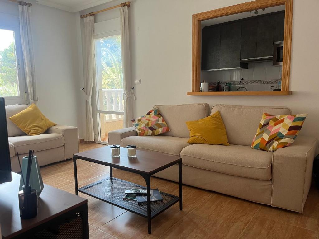 een woonkamer met een bank en een salontafel bij Casa La Marina spacious apartment 100m in La Marina