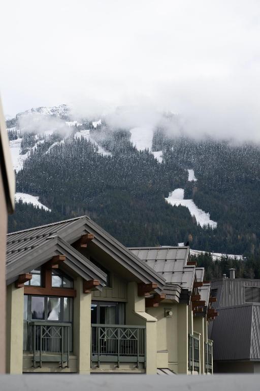 a building with a view of a mountain at Adara Hotel in Whistler