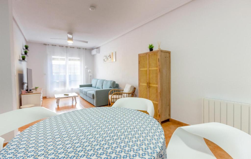 a bedroom with a bed and a living room at Awesome Apartment In Los Alcazares in Los Alcázares