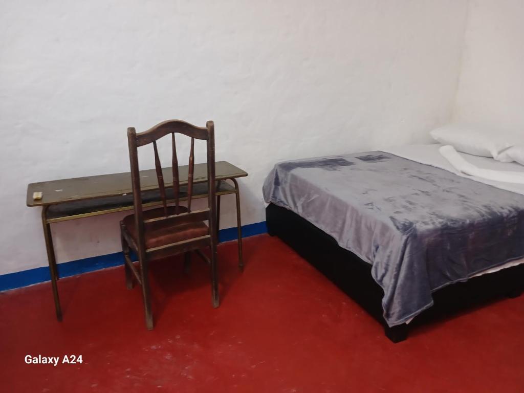 Postel nebo postele na pokoji v ubytování Hotel Deltoro