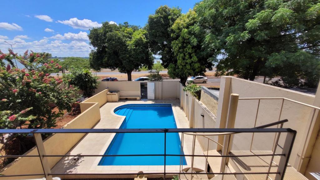a swimming pool on the balcony of a house at Apart Costanera II in Posadas