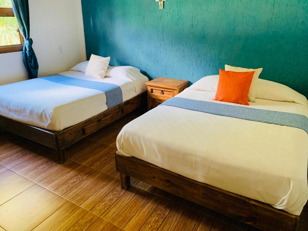 Postel nebo postele na pokoji v ubytování Cabañas los cactus 2