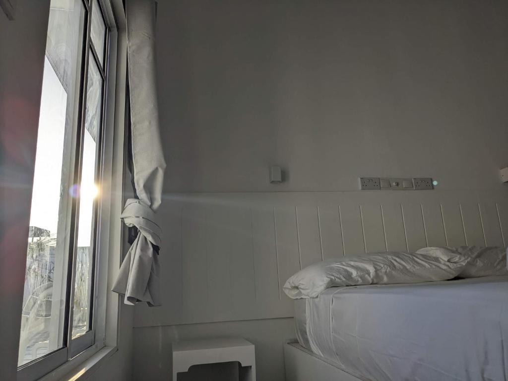 Postel nebo postele na pokoji v ubytování Avi Guesthouse