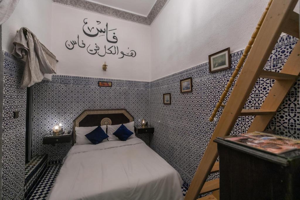 Postel nebo postele na pokoji v ubytování Riad Nayum