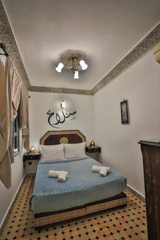 Postel nebo postele na pokoji v ubytování Riad Nayum