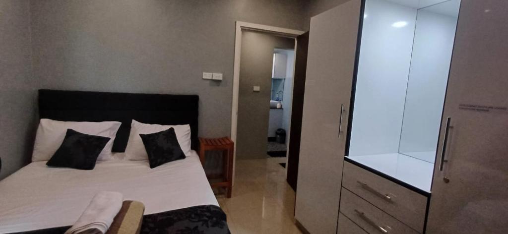 Postel nebo postele na pokoji v ubytování Prasad Apartments