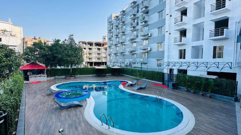 an image of a swimming pool in front of a building at Khan Palace Kuakata in Kuākāta