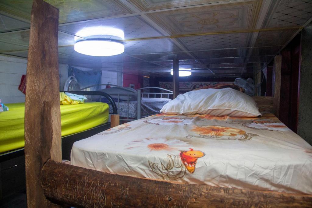 Voodi või voodid majutusasutuse Hostal Café Axi toas
