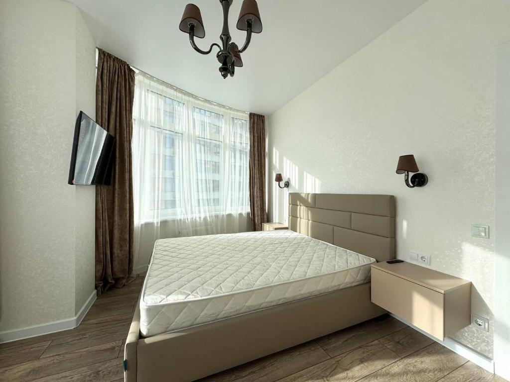 Postel nebo postele na pokoji v ubytování Arcadia Luxury Apartments