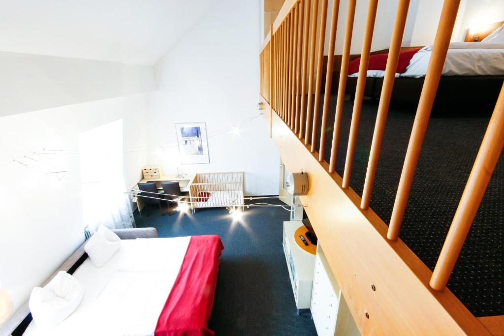 Postel nebo postele na pokoji v ubytování Hotel am Tiergarten