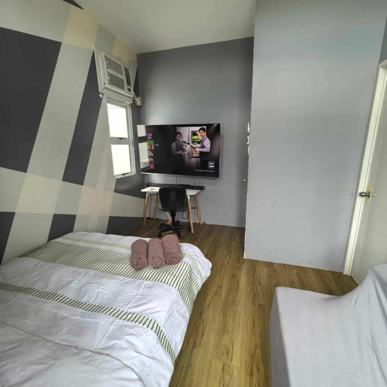 Postel nebo postele na pokoji v ubytování Davao City Airport Transient Rooms by Lemonique