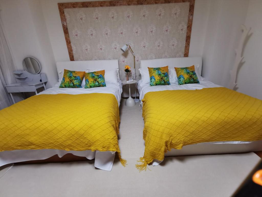 Postel nebo postele na pokoji v ubytování Yipinshiguang B&B