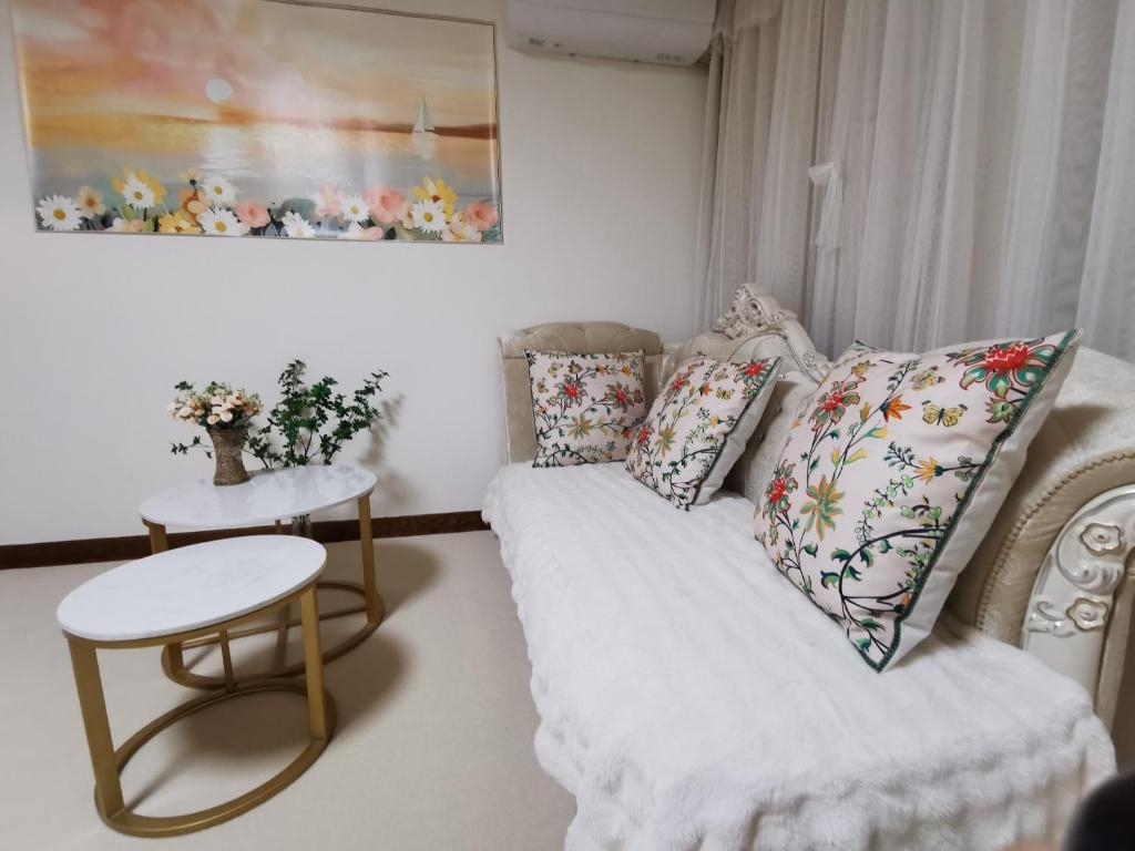 Postel nebo postele na pokoji v ubytování Yipinshiguang B&B
