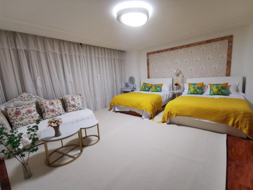 Postel nebo postele na pokoji v ubytování Yipinshiguang B&B