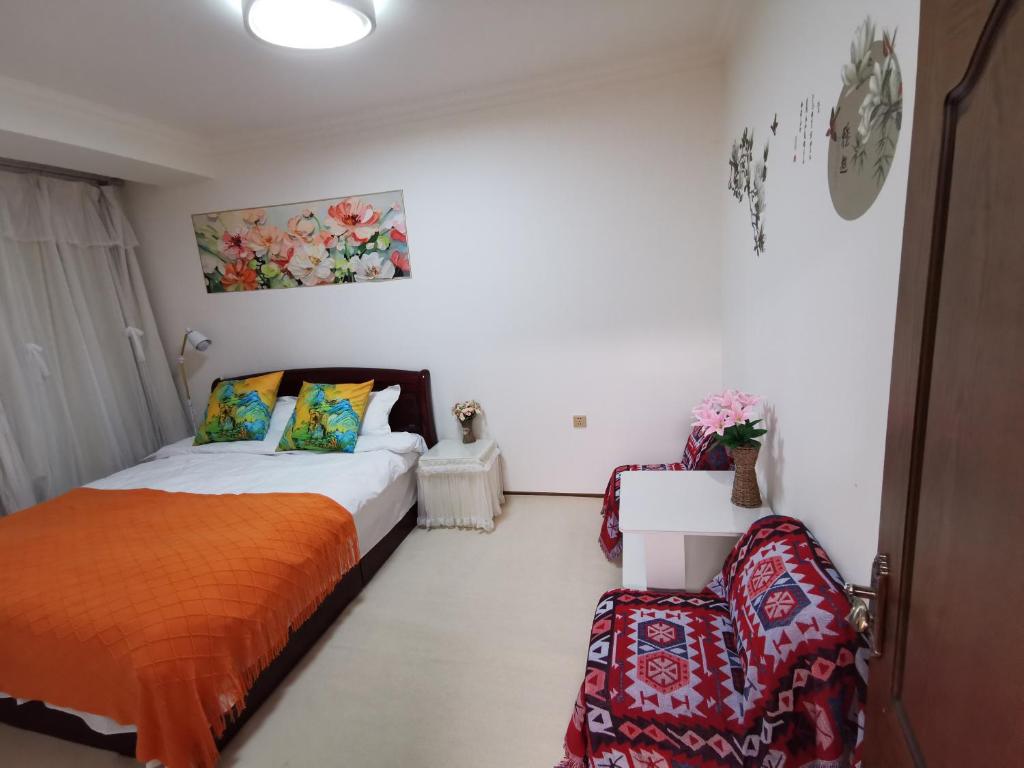 Postel nebo postele na pokoji v ubytování Yipinshiguang B&B