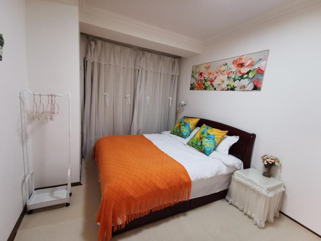 Postel nebo postele na pokoji v ubytování Yipinshiguang B&B