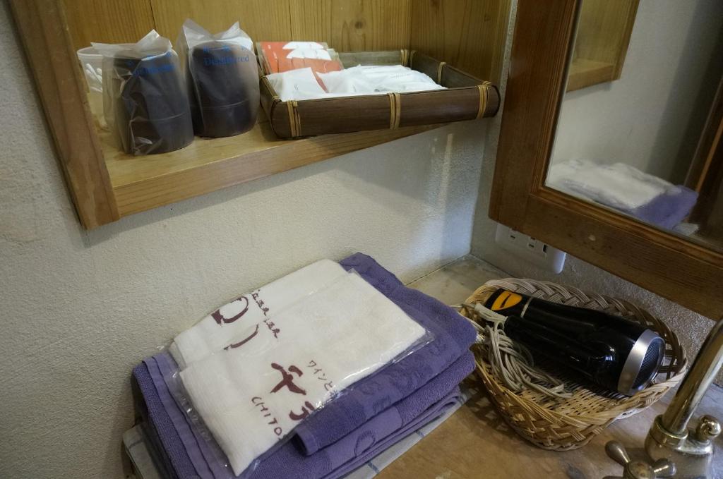 Postel nebo postele na pokoji v ubytování ワインとお宿千歳Chitose
