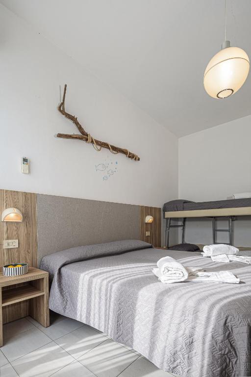Postel nebo postele na pokoji v ubytování Hotel Astrid