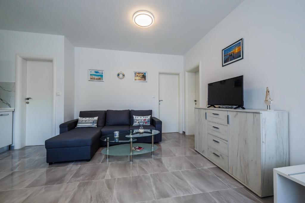 TV a/nebo společenská místnost v ubytování Ferienhaus Elias Nikola