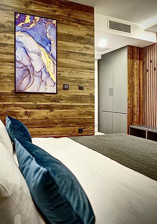 Postel nebo postele na pokoji v ubytování IG Hotel