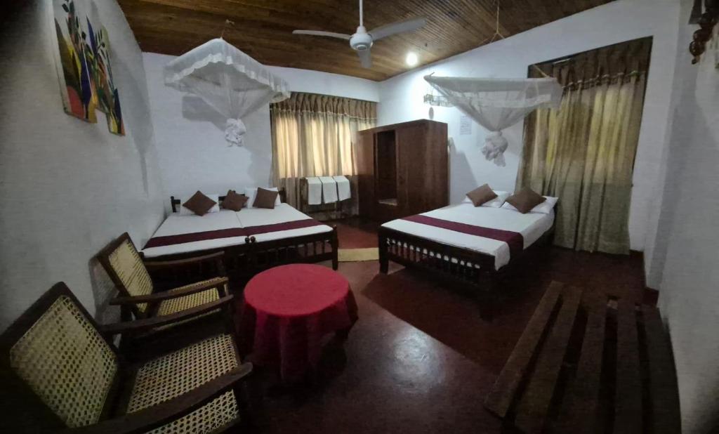 Ένα ή περισσότερα κρεβάτια σε δωμάτιο στο Lazy Bear Best Hostel in Kandy