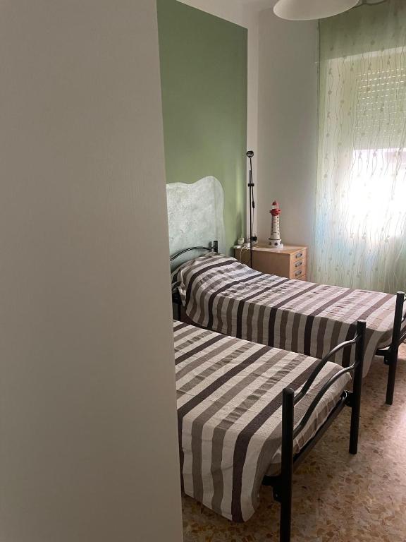 Letto o letti in una camera di Un mare di relax
