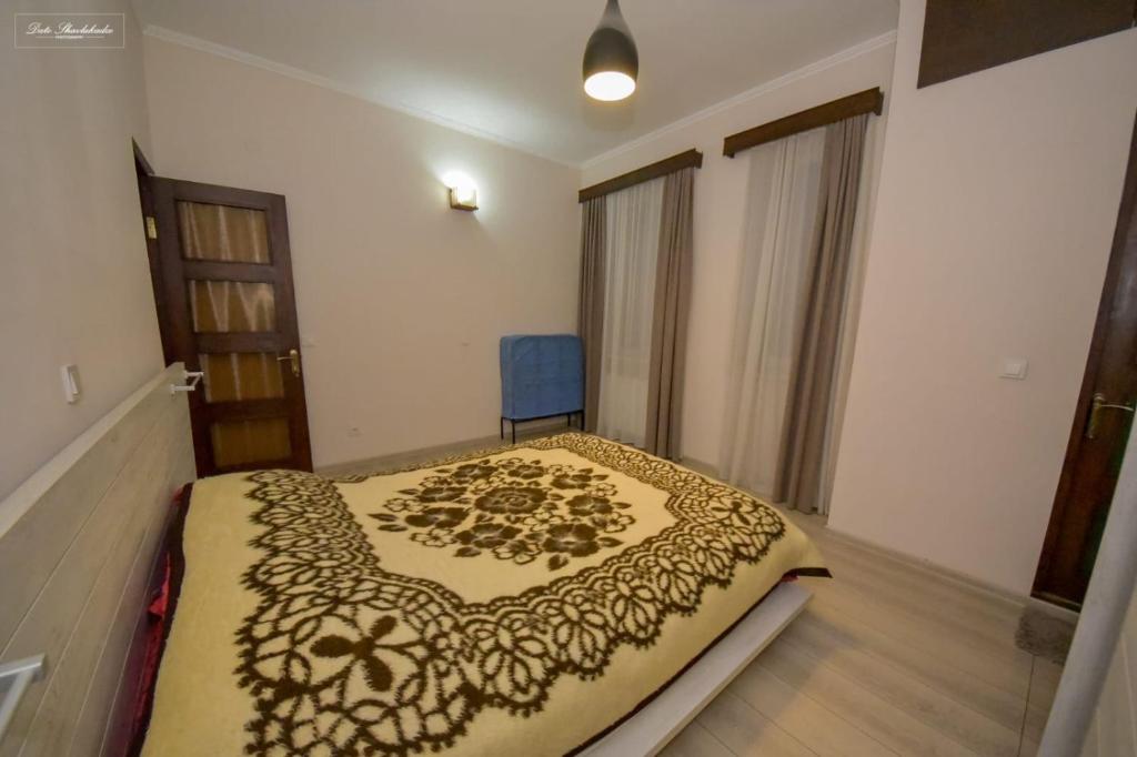 Postel nebo postele na pokoji v ubytování Apartment Soho Tabidze