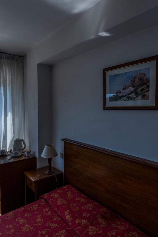 Postel nebo postele na pokoji v ubytování Hotel Isola Bella