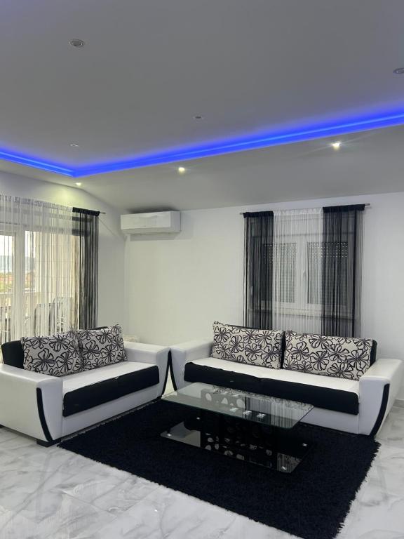 a living room with two couches and a table at MAK apartment in Kaštela