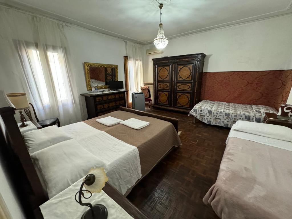 Postel nebo postele na pokoji v ubytování Residence Fortuny