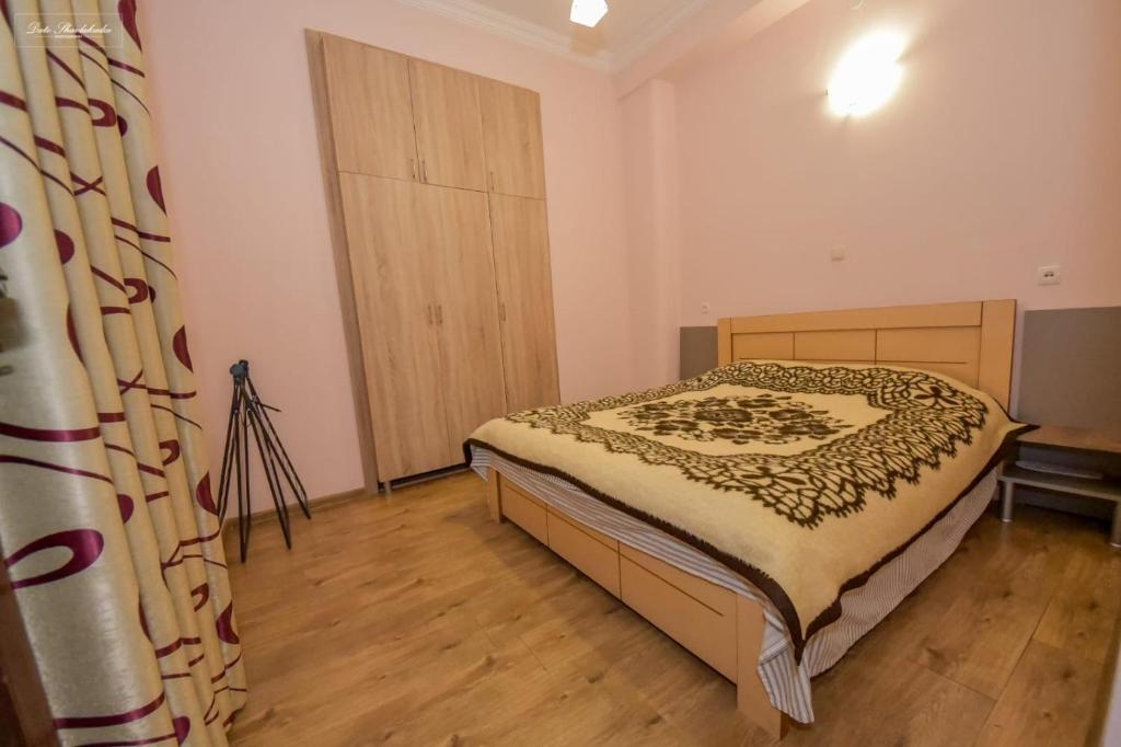 Postel nebo postele na pokoji v ubytování Apartment Soho Tabidze