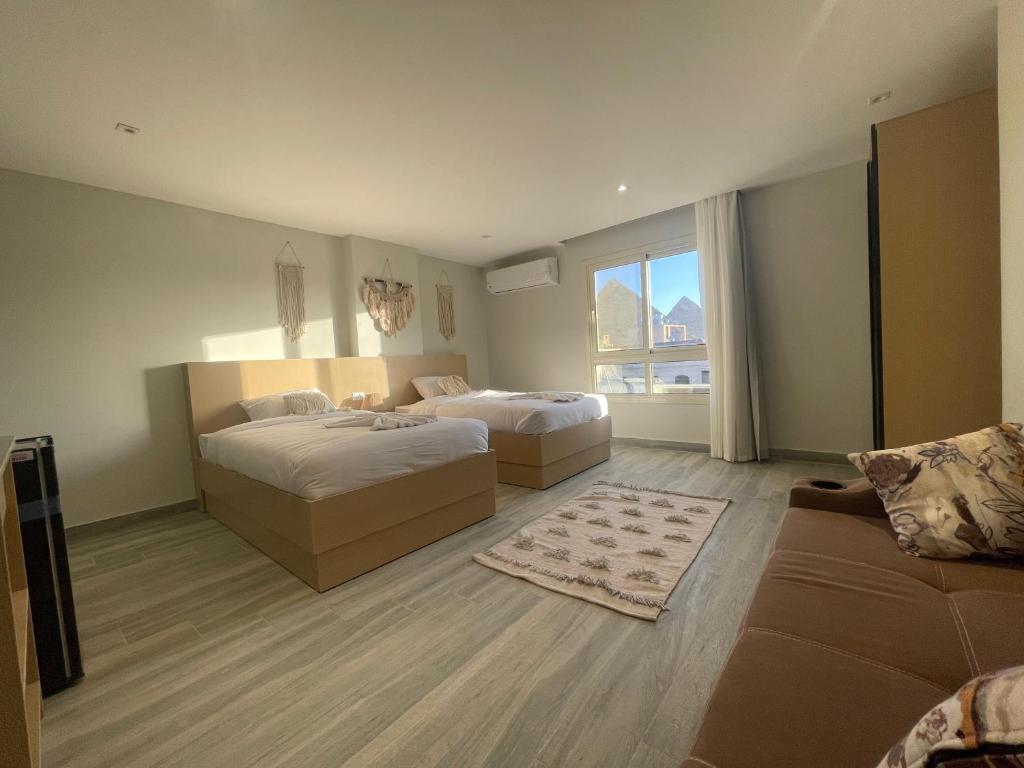 Postel nebo postele na pokoji v ubytování Diyar Pyramids Inn